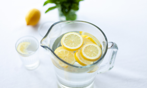 A cup of lemon water.