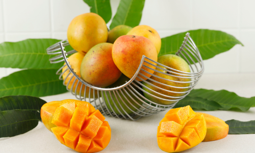 Mangoes are kept on a table.