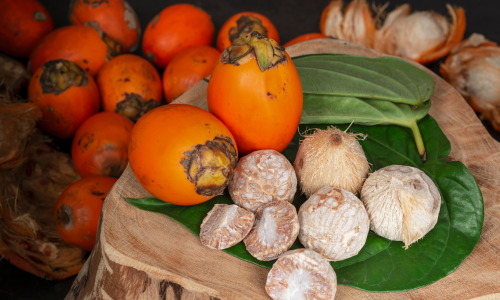 Areca nuts are on a surface.